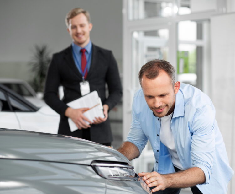 Buyer consulting with professional car advisor