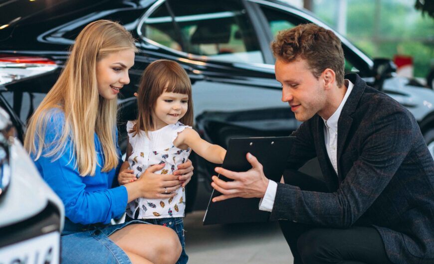 Family buying an SUV to save money with smart car financing and best SUV deals