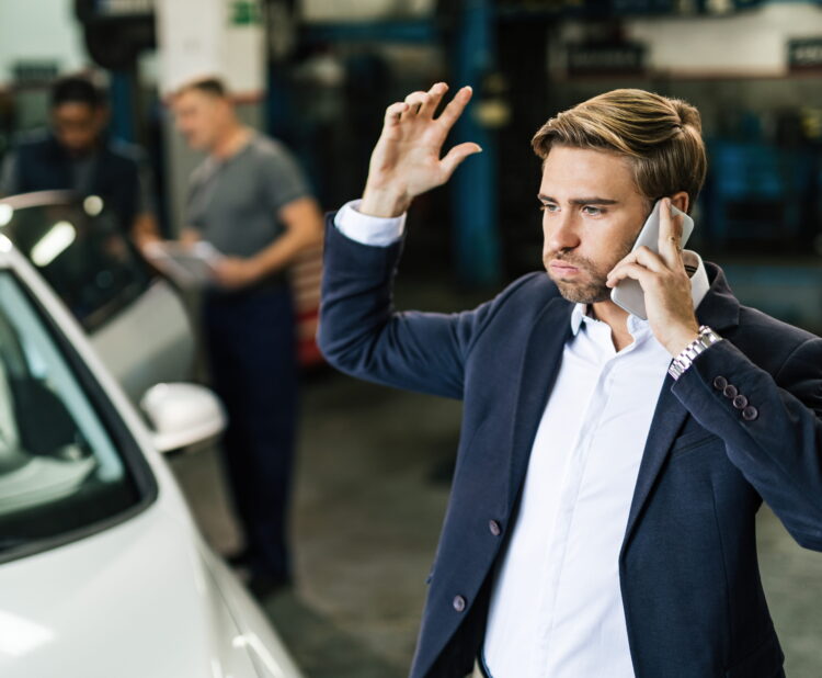 First time car buyer negotiating at a car dealership to avoid overpaying on new cars